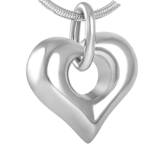 Heart-shaped ash jewelry with open detail – steel
