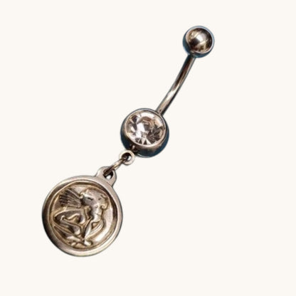 Steel navel piercing with angel