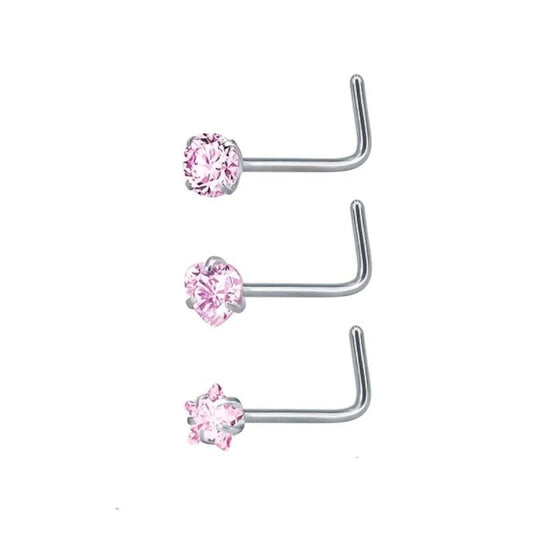 Drie roze kubieke stenen neuspiercings