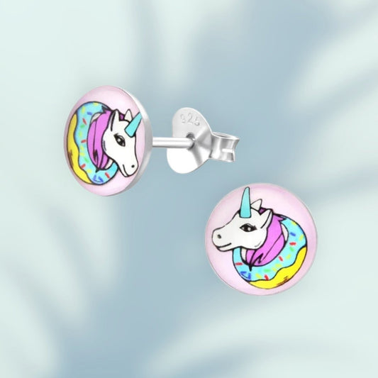 Aramat Jewels 7mm silver stud earrings with a colorful unicorn design on a pink background, featuring a unicorn head with a rainbow mane and a donut-like collar.