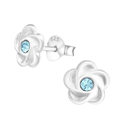 Silver flower stud earrings with blue crystals