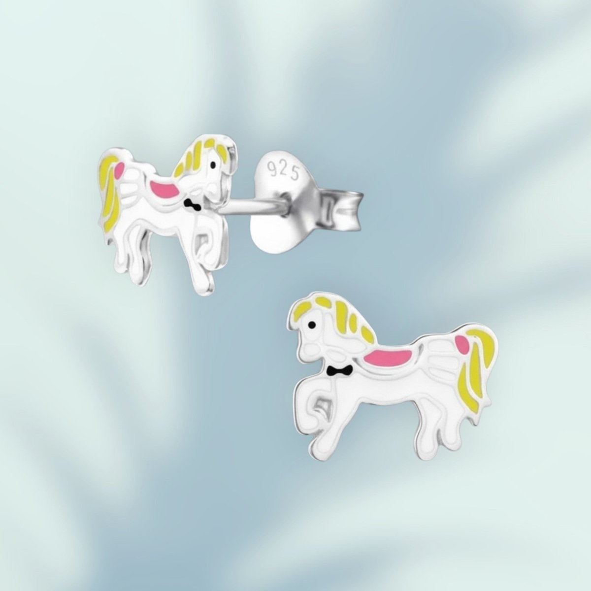 Aramat Jewels silver horse stud earrings with white, yellow, and pink enamel. Features a bow tie detail.