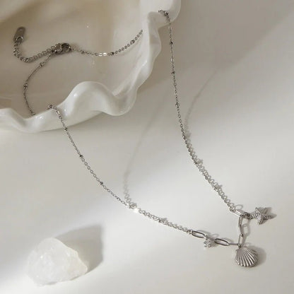 Zilverkleurige bedelketting met zeester, schelp & zirkonia – 40+5 cm - ket1183 - 658906 - Halskettingen kopen# - 40cm - alles - Bedelketting