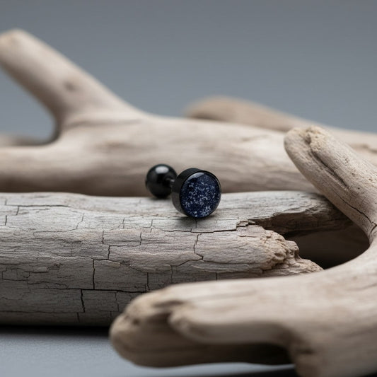 Aramat Jewels black bioplast tongue piercing with glitter detail and a black ball top.