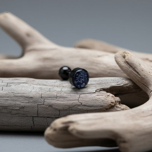 Aramat Jewels black bioplast tongue piercing with glitter detail and a black ball top.