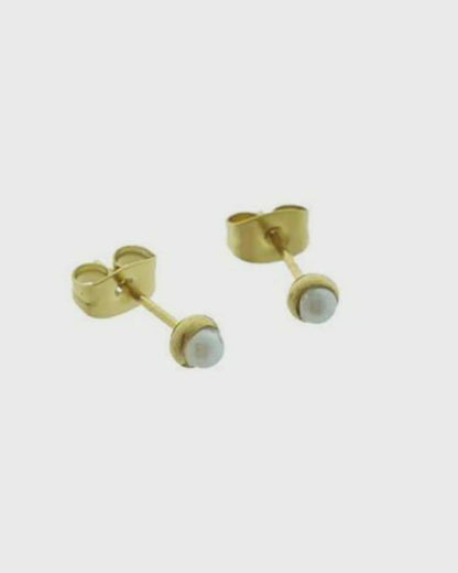 Gold-colored pearl earrings